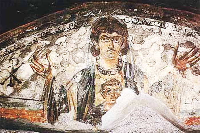Donna cristiana, con bambino, mentre prega. Affresco dalle catacombe del cimitero maggiore a Roma.
